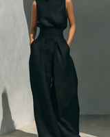 Nerina - Ärmelloser Jumpsuit mit weitem Bein in Schwarz