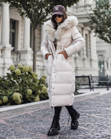 Damen Wintermantel | Lange Steppjacke | Warm Gefüttert | Kapuze mit Imitationsfell in Beige