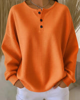 Damen nan Oversized Waffelstrick Henley-Pullover mit Knopfleiste und abgerundetem Saum Drune in Orange