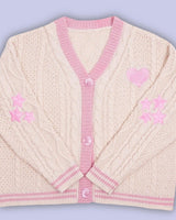 Damen nan gestrickte Cardigan mit Zopfmuster V-Ausschnitt und Herz- und Sternapplikationen Drune in Aprikosenrosa