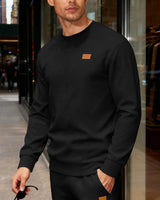 Herren nan strukturierter Baumwollstrickpullover mit Rautenstruktur, Rundhalsausschnitt und elastischen Bündchen Drune in Schwarz