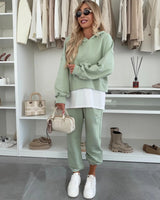 Damen Sportliches und modisches Hoodie-Set mit cropped Schnitt und bequemen Hosen Drune in Grün