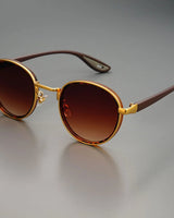 NoirGlow – Luxe Eclipse Rundsonnenbrille in Wüstennebel