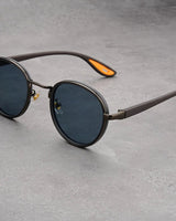 NoirGlow – Luxe Eclipse Rundsonnenbrille in Spannungsrauch