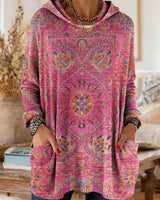 Vintage-inspirierte Kapuzenstrick-Tunika mit Taschen und ethnischem Druck in Pink