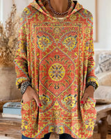 Vintage-inspirierte Kapuzenstrick-Tunika mit Taschen und ethnischem Druck in Orange