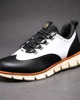 Heijnen – Sneaker Aus Leder im Wingtip Brogue Stil in Weiß/Schwarz