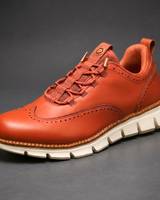Heijnen – Sneaker Aus Leder im Wingtip Brogue Stil in Orange