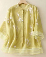 Damen Bluse mit Knopfleiste, Rundhalsausschnitt und floraler Struktur in Gelb