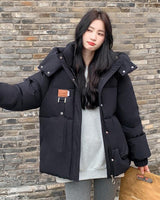 Damen Gesteppte Pufferjacke mit Kapuze Frontreißverschluss Brusttasche und Seitentaschen in Schwarz