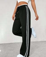Damen Hose mit Seitenstreifen und elastischem Bund in Schwarz