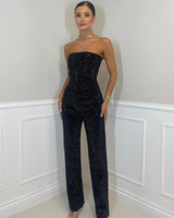 Damen Jumpsuit mit trägerlosen Oberteil und Seitentaschen in Schwarz
