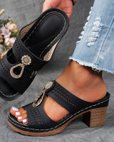 Damen Peep-Toe Mule-Sandalen mit Blockabsatz und Metallornament in Schwarz