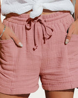 Damen Shorts mit elastischem Bund und Kordelzug sowie aufgesetzten Taschen und umgeschlagenen Säumen in Rosa