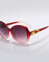 Damen-Sonnenbrille mit Schmetterlingsform und Metallic-Akzenten in Rot & Pink