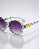 Damen-Sonnenbrille mit Schmetterlingsform und Metallic-Akzenten in Grau
