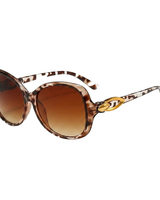 Damen-Sonnenbrille mit Schmetterlingsform und Metallic-Akzenten in Leopard