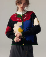 Damen Strickjacke mit Knopfleiste und Blumenmuster in Reliefstruktur sowie Bogensaum in Schwarz