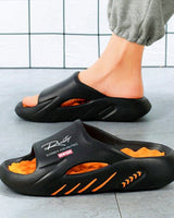 Sarynx - Gepolsterte Pantoletten in Schwarz Orange