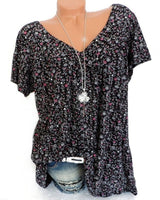 Sarita – Kurzärmelige Bluse Mit Blumenmuster in Schwarz