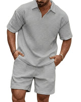 Herren-Set aus Poloshirt mit Viertelreißverschluss und Shorts mit Gitterstruktur in Grau