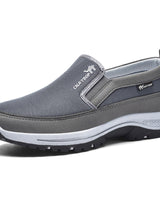 Herren Slipper mit Mesh-Oberfläche und Panelstruktur in Grau
