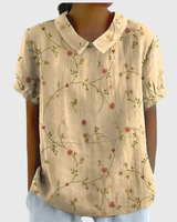 Kurzärmelige Damenbluse mit Blumenmuster und Bubikragen in Hellgelb