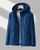 Miriam | Damen Wasserdichte Regenjacke mit Kapuze, Langer Schnitt und Muster Optik in Blau