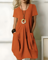 Eunate – Elegantes Baumwoll Kleid Mit Bauchweg-Effekt in Orange